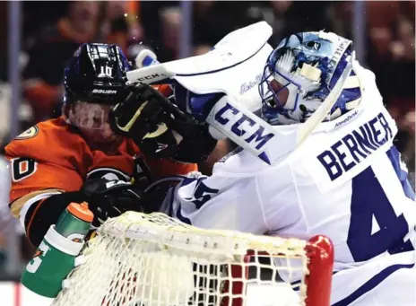  ?? HARRY HOW/GETTY IMAGES ?? Leafs’ Jonathan Bernier works over Anaheim’s Corey Perry during Wednesday’s 4-0 shutout of the Ducks. Bernier started Thursday’s game against L.A.