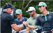  ?? MANUEL VELASQUEZ — GETTY IMAGES ?? LIV Golf CEO Greg Norman, left, shakes hands with Joaquin Niemann during last week’s event in Mexico.