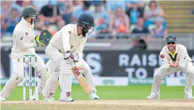  ??  ?? Moeen Ali is caught by David Warner during the first Test.