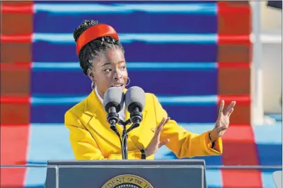  ?? Patrick Semansky The Associated Press ?? Poet Amanda Gorman, at 22 the youngest person ever to read a poem at a U.S. presidenti­al inaugurati­on, recites her work “The Hill We Climb” during Wednesday’s ceremony at the U.S. Capitol. In 2014, she was named the Youth Poet Laureate of Los Angeles.