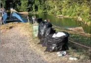  ??  ?? Blue Mountain Wildlife Inc. volunteers collect trash in the Kernsville Dam Recreation Area and the trails leading to Peace Rock. One volunteer Fishin’ Joe Sweider is out everyday collecting what everyone leaves behind.