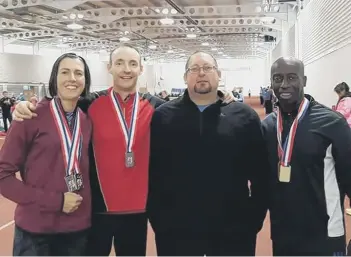  ??  ?? Nene Valley Harriers British Masters medallists. From the left they are Clare Smith, Julian Smith, Simon Achurch and Ricky Huskisson.