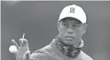  ?? PENNINGTON/GETTY IMAGES ?? Tiger Woods catches a ball during a practice round prior to the 2020 PGA Championsh­ip at TPC Harding Park on Tuesday in San Francisco.