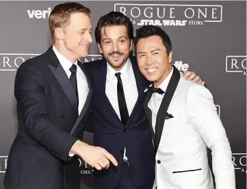  ??  ?? (From left) Actors Alan Tudyk, Diego Luna and Donnie at the premiere of Walt Disney Pictures and Lucasfilm’s “Rogue One: A Star Wars Story” at the Pantages Theatre in Hollywood. — AFP photo