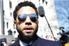  ??  ?? Smollett leaves court after charges against him were dropped by state prosecutor­s in Chicago, on Tuesday. — Reuters photo