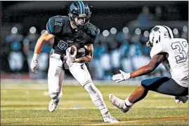  ?? ALLEN CUNNINGHAM/DAILY SOUTHTOWN ?? Lincoln-Way East’s Connor Kubik, left, cuts to avoid Plainfield South’s Nathan Playo during a Class 8A playoff game Nov. 1, 2019, in Frankfort. Lincoln-Way East won 40-0.