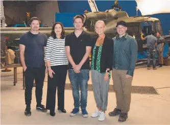  ??  ?? Danger Close producers John Schwarz, Michael Schwarz (second from left) and Martin Walsh (right) with Queensland premier Annastacia Palaszczuk and Screen Queensland CEO Tracey Vieira on the set at Arundel.