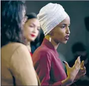  ?? Brendan Smialowski AFP/Getty Images ?? REP. ILHAN OMAR says the president is distractin­g Americans from his policies, which the Minnesota Democrat calls “the agenda of white nationalis­ts.”
