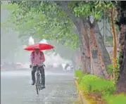  ?? RAVI CHOUDHARY/HT PHOTO ?? A man cycles in the rain on Thursday.