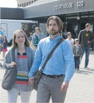  ?? BILL GRAVELAND/THE CANADIAN PRESS ?? David and Collet Stephan emerge from the courthouse in Lethbridge on Saturday after the Crown wrapped up its case against them. The Stephans are charged with failing to provide the necessitie­s of life for their 18-month-old son, Ezekiel, who died from...