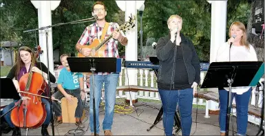  ?? Janelle Jessen/Herald-Leader ?? The worship band from Rogers Christian Church provided live music before the program began on Friday evening. Rose Sparrow and Tim Stone also performed during the event.