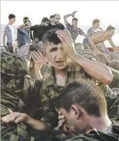  ?? Gokhan Tan Getty Images ?? SOLDIERS involved in the coup surrender in Istanbul. Thousands of people have been arrested.