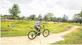  ?? PATRICK CONNOLLY/ORLANDO SENTINEL ?? Logan Schuck, 7, rides his bike at Orlando Mountain Bike Park.