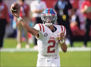  ?? Chris O’Meara / Associated Press ?? Ole Miss quarterbac­k Matt Corral throws a pass against Indiana during the first half of the Outback Bowl in Tampa, Fla., on Saturday.