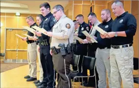 ?? Georgia Northweste­rn Technical College ?? Ten graduates of Basic Law Enforcemen­t Training Classes #201901 and #201902 said the “Oath of Honor” on Thursday, Dec. 12, to conclude graduation.