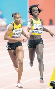  ?? FILE ?? Tiffany James hands the baton to Stephenie-Ann McPherson during the women’s 4x400m relay at the 2019 IAAF World Athletic Championsh­ips held at the Khalifa Internatio­nal Stadium in Doha, Qatar, on Sunday, October 6, 2019. The team that finished third in the final was completed by Anastasia Leroy and Shericka Jackson.