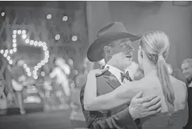  ?? Marie D. De Jesús / Houston Chronicle ?? Michael Weaver dances with Donna Settle at the 2017 Black Tie and Boots Presidenti­al Inaugurati­on Ball. Attendees were treated to music by Larry Gatlin and the Gatlin Brothers, as well as the Beach Boys.