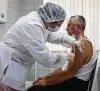 ?? Associated Press file photo ?? A Russian medical worker administer­s the Sputnik V vaccine in September.