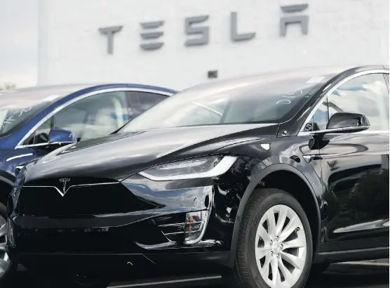  ?? DAVID ZALUBOWSKI/AP ?? By taking Tesla private, CEO Elon Musk believes the company will be able to sharpen its long-term focus of revolution­izing an automobile industry through its electric vehicles such as the Model X SUV, above, without worrying about investors’ fixation...