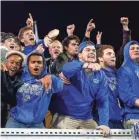  ?? LEAF-CHRONICLE HENRY TAYLOR/THE ?? Memphis fans cheer and celebrate their team's touchdown during the AAC Championsh­ip game between the Memphis Tigers and Cincinnati Bearcats at Liberty Bowl Memorial Stadium in Memphis, Tenn., on Saturday, Dec. 7, 2019.