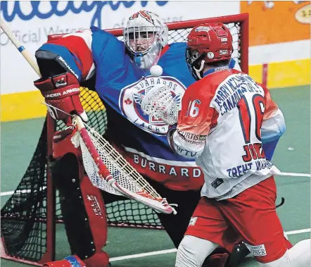  ?? CLIFFORD SKARSTEDT/EXAMINER ?? Peterborou­gh Century 21 Lakers' Adam Jones fires the ball at Maple Ridge Burrards' goalie Frank Scigliano during Game 2 action of the Mann Cup on Saturday at the Memorial Centre.