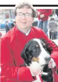  ??  ?? Choirmaste­r David Stevens and his Bernese mountain dog Ellie