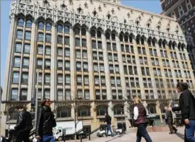  ?? Pam Panchak/Post-Gazette ?? In a 2013 photo, the Union Trust Building facing Grant Street. As part of a $100 million rehab, owner The Davis Companies of Boston restored the building’s opulence, from its Flemish-Gothic exterior to the brass and stained glass on the inside.