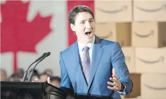  ??  ?? Prime Minister Justin Trudeau joined Amazon executives and employees to announce the online retailer will build a 38,000-square-metre tower on the site of Vancouver’s old post office.
