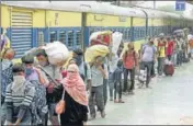  ??  ?? Migrant workers arrive at Danapur station in Patna on Thursday to board trains to their hometowns. SANTOSH KUMAR/HT