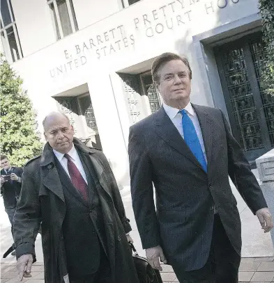  ??  ?? Paul Manafort, right, leaves U.S. District Court after pleading not guilty following his indictment on federal charges. WIN MCNAMEE / GETTY IMAGES