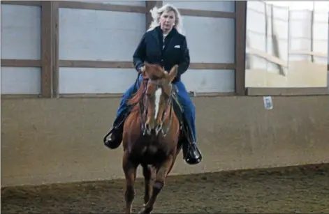  ?? KRISTI GARABRANDT — THE NEWS-HERALD ?? Georgi Anderson rides again 10 weeks after her bilateral mastectomy and reconstruc­tion surgery.