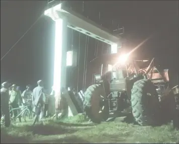  ??  ?? One of the tractors delivering wood and other materials for the constructi­on of the false door for the koker, last evening, at the De William, West