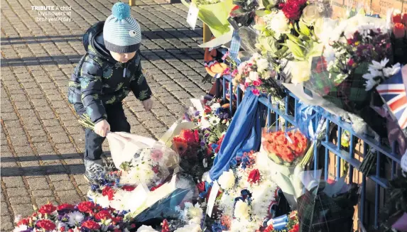  ??  ?? TRIBUTE A child lays flowers at Ibrox yesterday