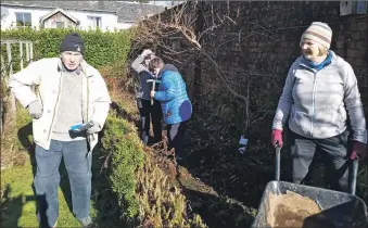  ?? ?? Right: Some of the helpers who gave the Green Shoots garden at Glencruitt­en a spring tidy.