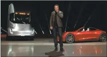  ?? TESLA ?? Elon Musk unveiled an electric semitraile­r and a sports car, upsetting customers with deposits on the Model 3 who face an 18-month wait.