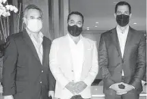  ?? ?? Mario Garcia-Serra (left), who lobbied for the 1505 Ponce project, Rishi Kapoor and Vince Lago pose for a photo during an event for Kapoor’s previous project, Villa Valencia, in February 2021.