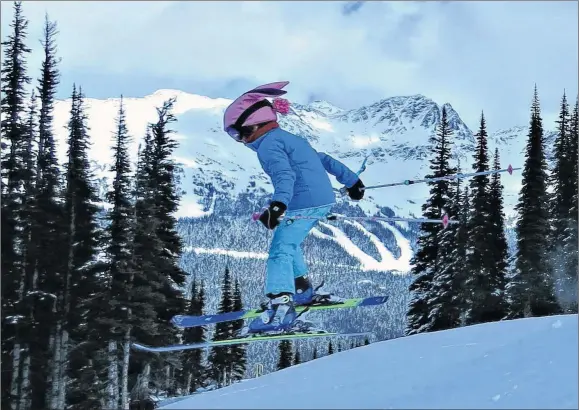  ?? RUTH HARTNOP/FLICKR ?? A young skier flies through the air at Whistler in British Columbia.