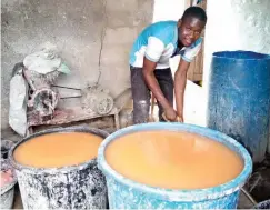  ??  ?? Yakubu preparing pap in his workshop.