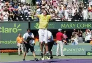  ?? LYNNE SLADKY — THE ASSOCIATED PRESS ?? John Isner celebrates after defeating Alexander Zverev, of Russia, during the final at the Miami Open tennis tournament Sunday in Key Biscayne, Fla. Isner won, 6-7 (4), 6-4, 6-4.