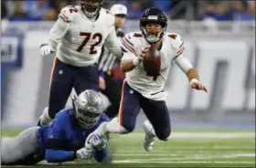  ?? PAUL SANCYA — THE ASSOCIATED PRESS ?? Detroit Lions defensive end Ezekiel Ansah stops Chicago Bears quarterbac­k Chase Daniel (4) during the second half of an NFL football game Thursday in Detroit.