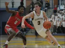  ?? ?? Nathan Steinman (3) of Clarkston brings the ball up-court as Orchard Lake St. Mary’s Sharod Barnes (0) defends during the game played on Thursday. Steinman had 24points for the Wolves.