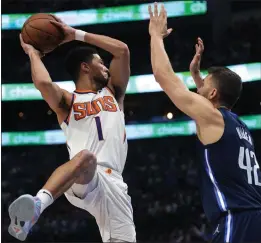  ?? TONY GUTIERREZ — THE ASSOCIATED PRESS ?? Phoenix Suns guard Devin Booker, left, will face off against the Dallas Mavericks and Maxi Kleber one more time in today's Game 7of the Western Conference semifinals.