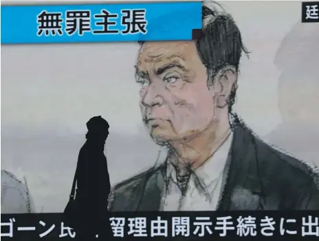  ?? EPA ?? A screen displaying a courtroom drawing of former Nissan chairman Carlos Ghosn attending a court hearing in Tokyo yesterday