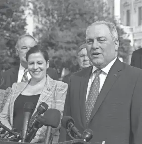  ?? J. SCOTT APPLEWHITE/AP ?? House Minority Whip Steve Scalise, R-LA., joined by House Republican Conference Chair Elise Stefanik, R-N.Y., left, and members of the GOP Doctors Caucus, speaks during a news conference about the delta variant of COVID-19 and the origin of the virus at the Capitol in on Thursday.