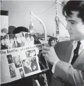  ??  ?? Come together: Elvis with a Beatles article in 1965