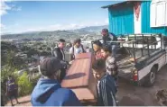  ?? THE ASSOCIATED PRESS ?? Relatives and neighbors carry the coffin containing the remains of Kimberly Dayana Fonseca, 19, in Tegucigalp­a, Honduras, on Saturday.