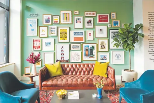  ?? Framebridg­e, via The Washington Post ?? Above: A gallery wall in Framebridg­e’s new store in Washington, D.C., features photos and mementos of the city sent in by Washington­ians.