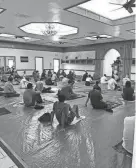  ?? PROVIDED ?? Muslims pray on their personal prayer rugs placed over a plastic covering as a COVID safety precaution at the Islamic Society of Greater Oklahoma City.