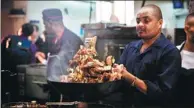  ?? LYU SHUAI / XINHUA ?? A chef works in the kitchen at the Tin Tin restaurant in central Nairobi, Kenya. It upholds Chinese cuisines while incorporat­ing Kenyan preference­s.