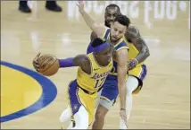  ?? AP photo ?? The Lakers’ Dennis Schroder drives against the Warriors’ Stephen Curry as Los Angeles’ LeBron James is called for a foul Monday.